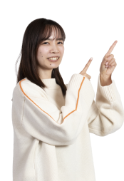 右を指さす女性
